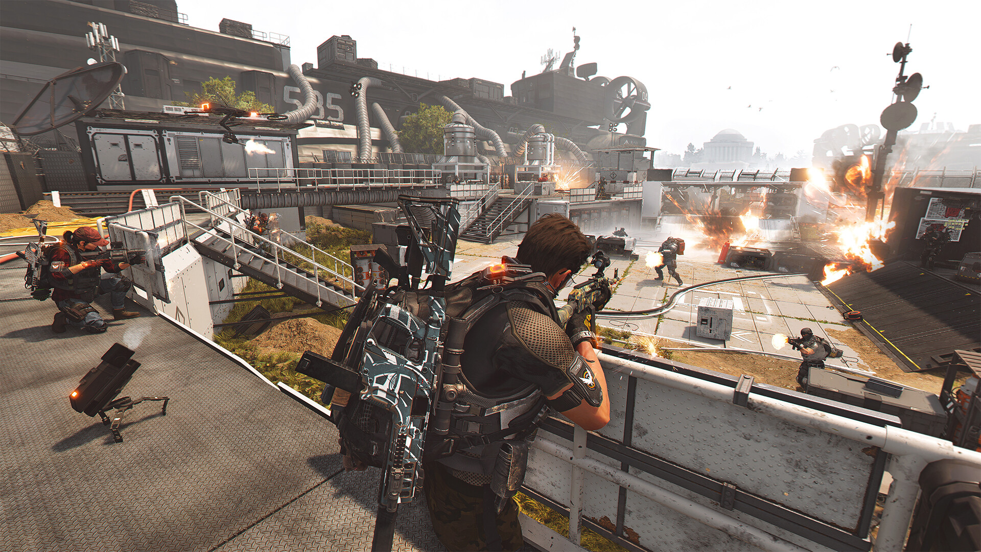 Agents fighting a boss in a Division 2 raid encounter.